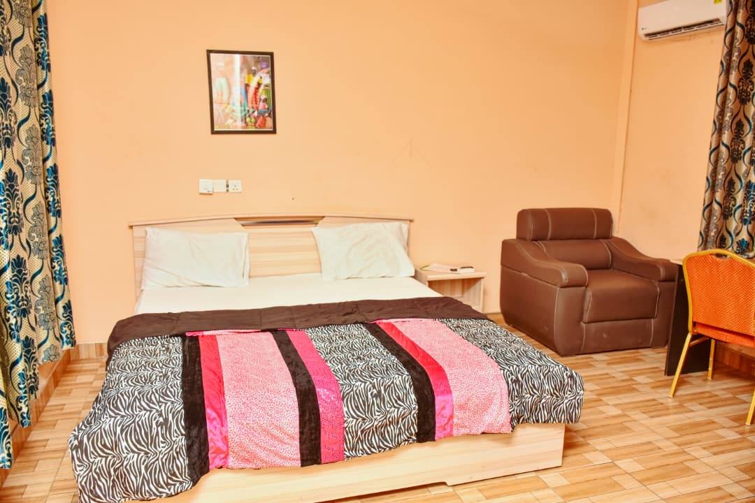 A bright, comfortable guest room with a double bed